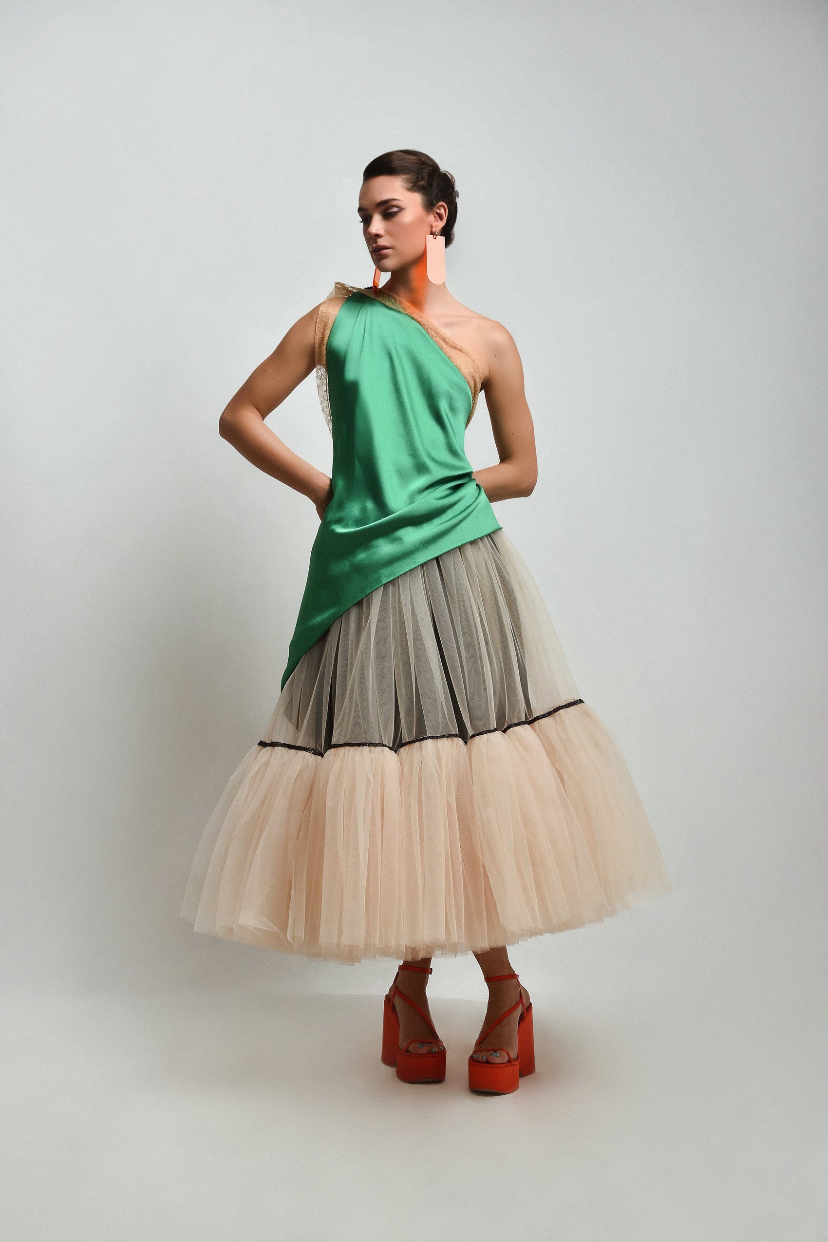 Green halter top with lace on the edges and a layered tulle skirt