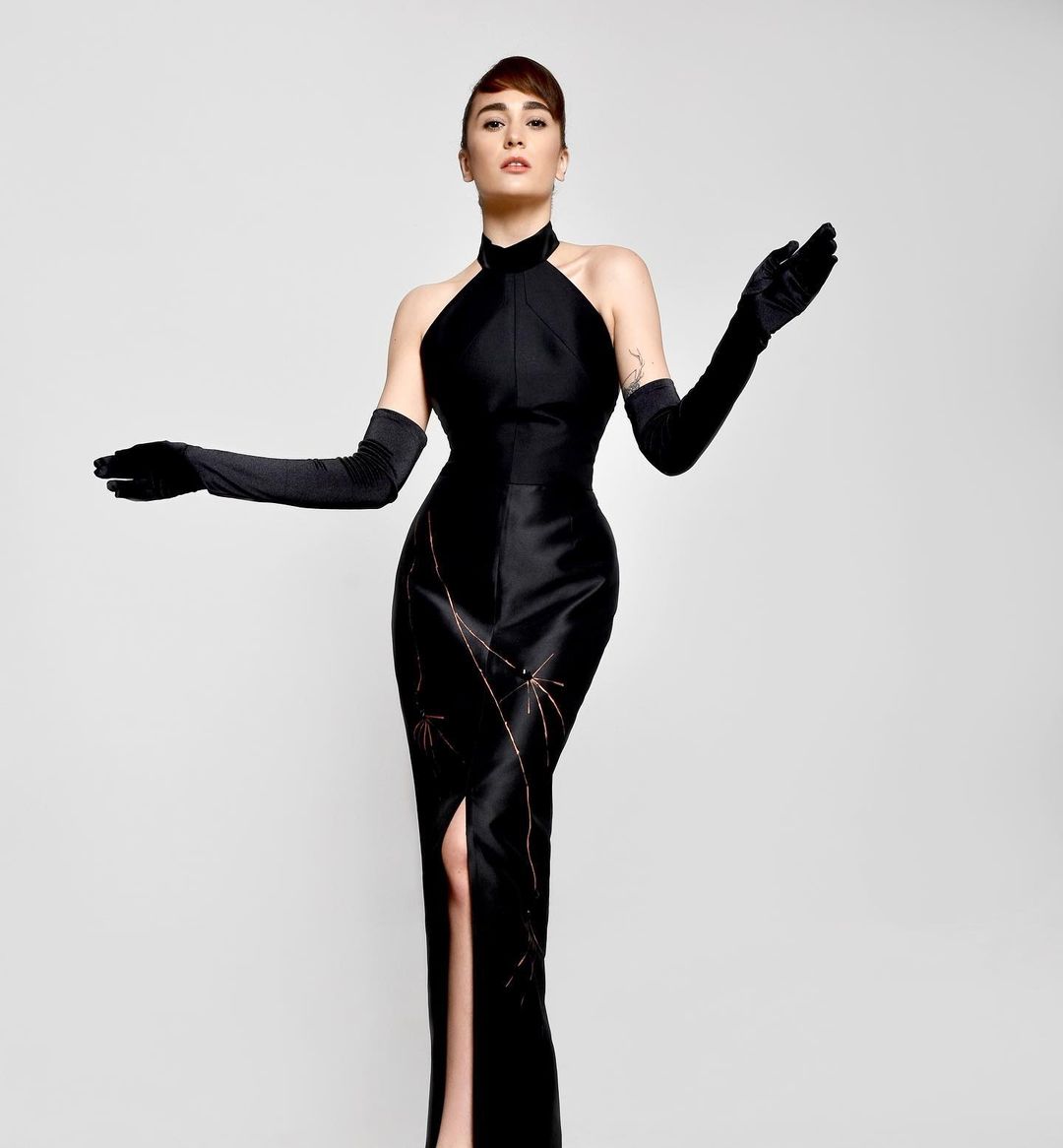 Classic black dress, with modern cuts and unique hand drawing