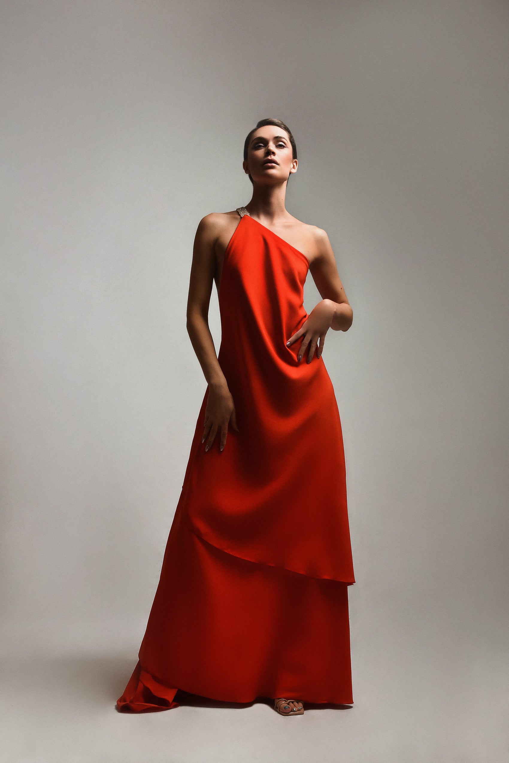 Red dress with an open back and belt with stones sewn by hand
